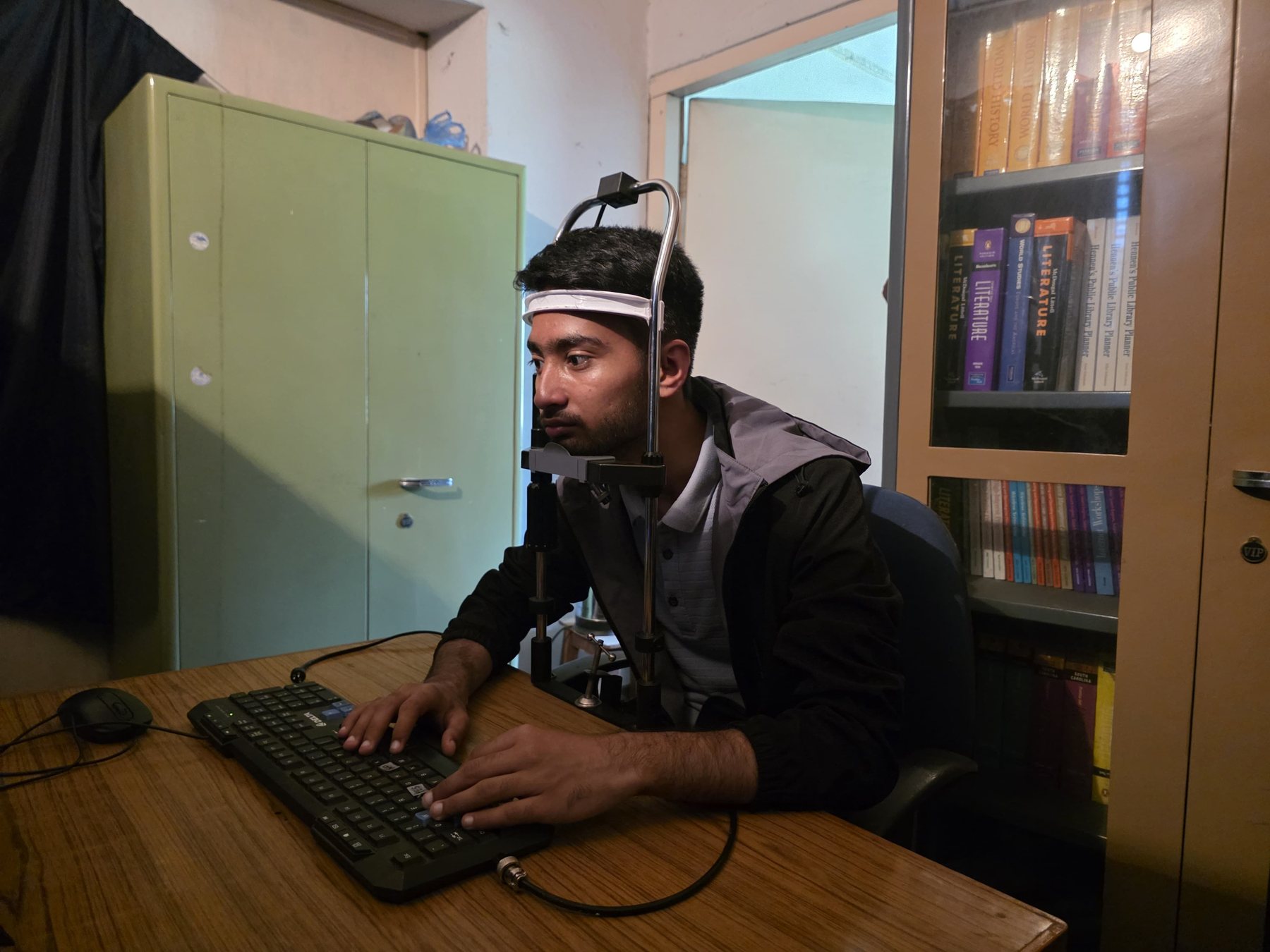 Side view of a participant positioned in the laboratory eye-tracking apparatus